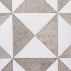 a white and grey tiled floor with triangles