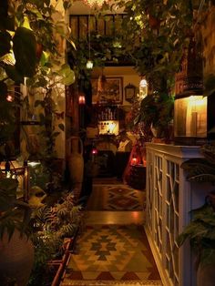 beautiful plants gothic alt plants foliage candle lit home decor Cottage Core Houses Interior, Bohemian Restroom Decor, Fairy Grunge Living Room, Wood Paneling Interior Design, Moon Aesthetic House, Forest Cottage Interior Bedroom, Whimsigothic Tiny Home, Eclectic Home White Walls, Low Budget Cottage Ideas