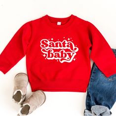 The cute Santa baby sweatshirt is fleece lined and cozy. It runs in sizes 2T through size 7 in kids. Toddler Christmas Shirts, Kids Christmas Sweater, Baby Christmas Shirt, Toddler Christmas Shirt, Christmas Bodysuit, Kids Christmas Sweaters, Toddler Size Chart, Santa Sweatshirt, Baby Christmas