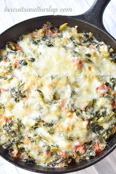 spinach casserole with ham and cheese in a cast iron skillet