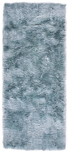 an area rug with grey fur on the top and bottom, in front of a white background