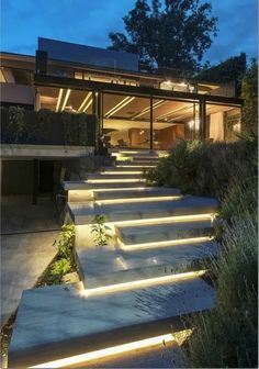 some steps that are lit up in front of a house