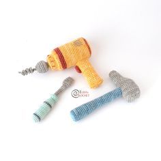 three crocheted toys are laying next to each other