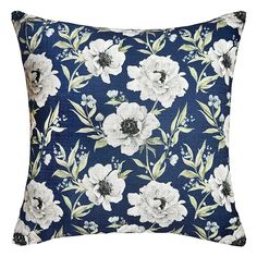 a blue pillow with white flowers on it