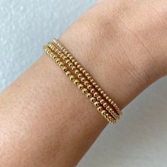 The Mini Goldens are here! They are so cute and dainty, and add a bit of sparkle to your wrist, or even your ankle! Definitely dainty enough to be ordered as an anklet. Need a different size? Just add in the notes section :) This listing is for one bracelet/anklet only and for 2mm, 2.5mm, or 3mm gold-filled beads only. Gold-filled beads should not tarnish or fade if handled with proper care. Please read care instructions below. No exchanges or returns. Please contact me anytime with any question Flexible Gold Beaded Bracelets With Tiny Beads, Everyday Gold Nickel-free Beaded Bracelets, Flexible Gold Bracelet With Tiny Beads, Gold Nickel-free Beaded Bracelets For Everyday, Nickel Free Gold Beaded Bracelets For Everyday, Dainty Gold Bracelet With Round Beads, Gold Bracelets For Everyday Wear, Tiny Gold Bracelets For Everyday Wear, Everyday Tiny Gold Bracelets