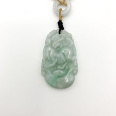 This is a high grade jadeite jade pendant necklace. It is exquisitely hand carved, so each pendant is different in some way. The pendant is completely natural jade, un-dyed and in its natural form. The pendant is carved in the form of the Chinese Zodiac - Dog. The beads above the pendant on the necklace are natural hand carved jadeite jade beads. They may not be perfectly round because they are hand carved. This gives the necklace a more rustic and natural stone like look. The years of the Dog i Carved Jade Pendant Necklace, Engraved Jade Amulet Jewelry, Carved Jade Jewelry For Good Luck, Carved Oval Jade Jewelry, Oval Carved Jade Jewelry, Carved Jade Pendant Jewelry, Dog Chinese Zodiac, Red Pendant Necklace, Red Pendants