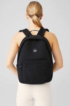 Stow Backpack - Black/Silver | Alo Yoga Sporty Backpack With Functional Pockets For On-the-go, Modern Nylon Sports Backpack, Sporty Backpack With Mesh Pockets, Sporty Backpack For Commuting, Functional Everyday Bag With Mesh Pockets, Sporty Standard Backpack For Commuting, Sporty Commuting Backpack, Modern Sports Backpack, Sporty Backpack With Zipper Pocket