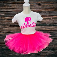 a pink tutu skirt and white t - shirt with the name amelie on it