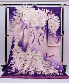 A beautiful wedding Uchikake Kimono with extensive embroidery.  This purple long sleeved Japanese dress is made of high quality silk with floral details.  Enjoy the luxury and quality of Japanese Kimono. Vintage Japanese Kimonos are a unique and stunning piece of Japanese culture. Kimono's are made completely by hand and are considered a wearable work of art. Item: Silk Furisode Kimono Robe No. yukn381 Size: US  L   /  Length  76.7inch (195cm) , Width 26.7inch (68cm) Condition: Used, Very Good.P Pink Silk Kimono For Wedding, Pink Silk Wedding Kimono, Long Embroidered Kimono For Wedding, Wedding Embroidered Kimono With Kimono Sleeves, Long Floral Embroidered Kimono For Wedding, Purple Kimono Traditional, Traditional White Kimono For Wedding, Traditional Wedding Kimono With Floral Embroidery, Embroidered Wedding Kimono