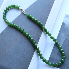 --- SPECIFICS --- 💚Materials: 100% Natural High Quality Green Nephrite Jade With s925 Sterling silver. Jade is from Canada, vivid green color with slight black spot. 💚Closure: the closure is made of 925 Sterling Silver.  💚Necklace size: 16 -- 26 Inches 💚Bead Diameter: 8.0mm Please Note: The picture shown is for matching suggestion purposes only. This listing is for the jade necklace only and does not include the jade bracelet. 6mm bead jade necklace: https://gioiellohandcrafted.etsy.com/list Stackable Necklaces, Nephrite Jade, Natural High, Jade Necklace, Jade Bracelet, Handmade Artwork, Jade Jewelry, Jade Beads, Green Jade