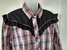 "Western / cowgirl blouse by Kenny Rogers Western Collection by Karman in black, red, and white plaid. Snap front and cuffs. Tag size 19-20 - made in USA. Armpit to armpit laying flat: 22\" (44 inches total under the armpits); Slightly fitted - measures 21 inches laying flat at waist and 23 inches at hips laying flat. 27 inches long from collar to bottom hem. Clean, no stain - not faded - like new! Clothing is measured laying flat, so the actual fit will be smaller. Measure a similar garment tha Fitted Plaid Western Tops, Fitted Western Plaid Tops, Red Western Style Tops For Ranch, Cowgirl Blouse, 90s Western, Red And White Plaid, Kenny Rogers, Ruffled Blouse, Motif Vintage