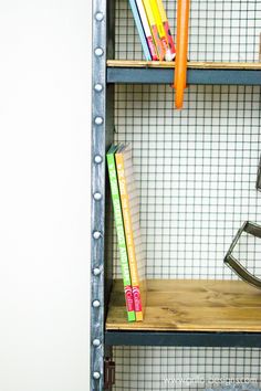 a metal shelf with books on top of it