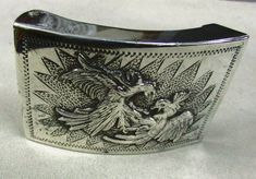 "Sterling silver belt buckle. 3 1/8\" wide x 2 1/16\" tall. The inside is stamped sterling Mexico DVll. Frank Tucker 1974 Ensenada is engraved on the inside. This will work with a 2\" or smaller belt. There are two birds who appear to be fighting as a design. There are some surface scratches from being worn. Still wearable. SBKL-1" Western Engraved Belt Buckles For Formal Wear, Silver Western Belt Buckles For Formal Occasions, Vintage Engraved Belt Buckles For Formal Occasions, Vintage Concho Belt Buckles For Formal Wear, Silver Western Belt For Formal Occasion, Western Style Silver Belt For Formal Occasions, Antique Engraved Belt Buckles For Formal Wear, Classic Silver Belt Buckles As Gift, Classic Silver Belt Buckle As Gift