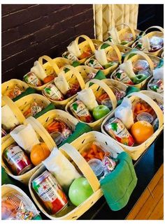 several baskets filled with fruits and vegetables on a table