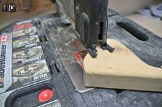 a piece of wood being worked on by a machine