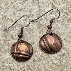 A smaller version of the round freeform folded earring that goes well with the round foldformed pendant. 3/4" diameter Drop from ear approximately 1 1/2 inches. Nickel-free Bronze Circular Earrings, Bronze Round Earrings, Bronze Copper Round Earrings, Unique Bronze Round Earrings, Nickel-free Copper Circle Earrings, Artisan Bronze Round Earrings, Round Electroformed Metal Earrings, Electroformed Round Metal Earrings, Nickel-free Round Pendant Metal Earrings