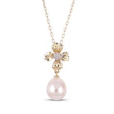 Impossible to ignore, this cultured pearl flower necklace is always a lovely choice. 10K yellow gold Diamond accents center the polished, sculpted flower bail Beneath, an oval 8 x 9mm freshwater cultured pearl dangle draws the eye 18-inch cable chain with spring ring clasp Elegant Pearl Necklace With Flower Charm, Elegant Pearl Necklaces With Flower Charm, Elegant Flower-shaped Pearl Necklace With Charm, Elegant Flower-shaped Necklace With Pearl Drop, Elegant Flower-shaped Pearl Pendant Necklace, Elegant Flower-shaped Pearl Drop Necklaces, Formal Flower-shaped Pearl Pendant Jewelry, Pearl Flower Necklace, Mens Gemstone Rings