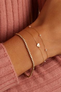 Add a little love to your stack with a diamond and solid gold heart bracelet. This heart bracelet comes in a set so you can match with your best friend, mom, sister or another loved one. Silver Dainty Bracelets, Gold Cute Jewelry, Dainty Heart Bracelet, Bracelet Aesthetic Gold, Initial Bracelet Couples, Dainty Bracelet Stack, Bond Bracelet, Bracelet Aesthetic, Gold Bracelets Stacked