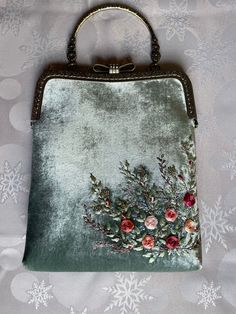 Minty velvet handbag with roses embroidery , velvet handbag, silk roses embroidery,made in our studio  ❤️ *Our handmade rose embroidered minty velvet handbag  *Great gift for yourself or your loved ones.  *romantic piece for girls or women *embroidered with Moulin thread and silk  *Elegant and stylish, unique, one of a kind vintage style velvet handbag is perfect just for you! *Super easy to use  ⁍ I am open to custom orders and personalization.  ⁍You can choose color, size, and flower to embroider and we can embroider monogram as well. ⁍Text us in messages your desires, you can check out our shop for inspiration and ideas. ⚠The color on the photo may be a bit different from the real model, because of the lighting.  Check out the shipping time below ⬇ 🔸Dimensions / ⁍ 24-25Cm Length of the Cheap Vintage Clutch For Party, Luxury Velvet Evening Bag As A Gift, Velvet Clutch For Wedding, Rectangular Velvet Wedding Bag, Velvet Rectangular Wedding Bags, Rectangular Velvet Wedding Bags, Handmade Rectangular Velvet Bag, Handmade Rectangular Velvet Bags, Handmade Velvet Rectangular Bags