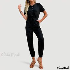 Olivia Mark - High-Waisted Solid Color Jumpsuit with Short Sleeves and Tapered Legs for Casual Wear Casual Jumpsuits And Rompers For Daywear, Casual Fitted Jumpsuits With Elastic Waistband, Fitted Casual Jumpsuits With Elastic Waistband, Casual High Waist Jumpsuits And Rompers For Loungewear, Casual Short Sleeve Jumpsuits And Rompers With Elastic Waistband, Casual High Waist Jumpsuits And Rompers, Casual Jumpsuits And Rompers With Short Sleeves, Fitted Casual Plain Jumpsuits And Rompers, Casual Fitted Plain Jumpsuits And Rompers