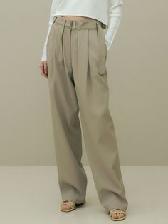 Editor's Notes The pants have a masculine, simple mood.  - Elegant, casual look- Polyester-spandex material to wear all year round- Unique belt designMeasurements(in.)S / M- Length: 41.93 in. / 42.32 in.- Waist: 14.57 in. / 15.55 in.- Front Rise: 13.98 in. / 14.37 in.- Back Rise: 17.52 in. / 17.91 in.- Thigh: 14.17 in. / 14.96 in.- Bottom Hem: 9.25 in. / 9.65 in. Model info: Height 5' 7.5'', Waist 24 in., Hip 35 in.Composition & Care- 96% Polyester, 4% Polyurethane- Classic Neutral Pants With Belt Loops, Khaki Straight Dress Pants For Business Casual, Khaki Tapered Leg Dress Pants For Business Casual, Classic Full-length Neutral Pants, Taupe Straight Leg Pants For Work, Business Casual Khaki Pants With Belt Loops, Classic Khaki Pants, Classic Full Length Khaki Pants, Classic Full-length Khaki Pants