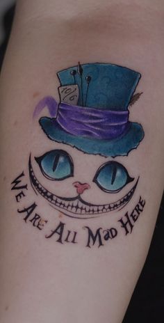 a cat with a top hat on it's head and the words we are all mad here