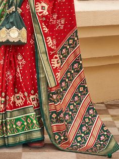 Introducing our fabulous red patola printed silk wedding wear saree with a blouse! This stunning saree is designed with a traditional look that is perfect for weddings, festivals, and other special occasions. Made from high-quality silk material, it features a vibrant red color that is sure to make a statement wherever you go.
Whether you're attending a wedding or a festival, this saree is designed to enhance your overall look and make you stand out from the crowd. The patola printed work all ov Bollywood Style Red Pre-draped Saree With Printed Border, Festive Red Pre-draped Saree With Bandhani Print, Festive Fitted Pre-draped Saree With Printed Border, Pre-draped Saree With Printed Border For Festive Occasions, Festive Fitted Saree With Printed Border, Pre-draped Saree With Printed Border For Eid, Festive Pre-draped Saree With Printed Border For Eid, Eid Festive Pre-draped Saree With Printed Border, Red Sets With Printed Border For Eid