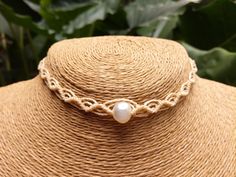 "Hand woven macrame Pearl choker necklace. This waterproof waxed string choker is the perfect beach accessory for all! Adjustable one size fits all  Hand woven Light Creamy Beige macrame choker with cultivated fresh water pearls. Available in a variety of colors Woven with top quality waxed polyester Linhasita string from Brazil, it's waterproof and fade resistant.  Adjustable slip knot closing system, your choker will never be too tight or too loose and it will always stay in place  1/4 inch width for an elegant style. Looks great combined with other longer necklaces for a cool layered effect  You can also use it as a hair band for a summer beach look. Made with love.   :) We can also create custom work if you have any special requests. * PLEASE NOTE : The \" processing time \" is the tim Adjustable Macrame Choker, Adjustable Cream Choker, Handmade Cream Choker Necklace, Bohemian Adjustable Pearl Necklace For Summer, Handmade Necklaces With Waxed Cord, Adjustable Bohemian Pearl Necklace For Summer, Adjustable Pearl Necklace For Summer Gift, Adjustable Pearl Necklace Summer Gift, Adjustable Waxed Cord Choker