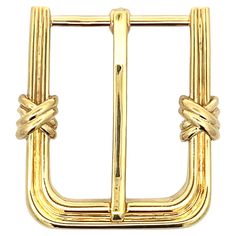 This elegant belt buckle, meticulously crafted from 18k yellow gold, embodies a perfect blend of sophistication and style. Designed with an opening suitable for a 1" belt, this buckle is as functional as it is luxurious. Each side of the buckle features distinctive X motifs, adding a touch of intricate detail and visual interest. The warm glow of the yellow gold enhances its timeless appeal, making this buckle a refined accessory that elevates any belt. Whether for formal occasions or everyday w Luxury Brass Buckle Belt Buckles For Business, Designer Formal Belt Buckles With Gold-tone Hardware, Designer Belt Buckles With Gold-tone Hardware For Formal Wear, Designer Gold-tone Belt Buckles For Formal Wear, Designer Brass Buckle Belt For Formal Occasions, Classic Gold Antique Buckle Belt Buckles, Classic Gold Antique Belt Buckle, Classic Antique Gold Belt Buckle, Classic Gold Belt Buckle