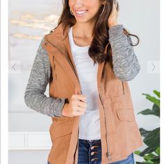 This Utility Jacket Is A Fall Must Have! We Absolutely Love That Combination Of Of Fabrics! The Body Is Like A Classic Utility Jacket With All The Pockets But The Sleeves And Hood Are Like A Cozy Sweatshirt. This Jacket Features A Zip Up And Button Closure, Contrasting Fabric, A Hood, And Pockets. Sold Out Online In All Sizes! Camel Color Is Accurate In The Picture Posted Not The Website Photos (Which Make It Appear Lighter) I Did Take The Tag Off But Never Worn. I Cannot Return After 2 Weeks Casual Taupe Outerwear For Fall, Khaki Utility Jacket For Fall Layering, Casual Brown Outerwear For Layering, Casual Taupe Outerwear For Everyday, Brown Fall Utility Jacket For Everyday, Brown Utility Jacket For Everyday Fall Use, Brown Utility Jacket For Everyday Fall Wear, Fall Beige Utility Jacket For Outdoor, Taupe Outerwear For Everyday Fall Wear