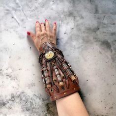 This steampunk brown cuff was made to order for a cosplay event. We created it from scratch.  The watch used in the design will be replaced by something similar because we had only one piece.   The bracelet was made of genuine cow leather and decorated with glass vials and various metal parts following the steampunk style.  The bracelet's width is about 20 cm (7.9 in) It can be personalized to your size. So, please leave your measurements at the checkout. Please measure your wrist to get the pro Leather Vampire, Brown Cosplay, Steampunk Style, Glass Vials, Steampunk Jewelry, Steampunk Fashion, Leather Fashion, Cow Leather, Leather Bracelet