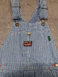 "Kid's vintage 1960s blue and white hickory stripe denim overalls by Ely & Walker 'Red Ball' Sanforized Denim. Made in U.S.A Features single button fly No Tag Approximately sz. 7 (U.S.A Kid's) Measurement taken laying flat: Waist: 13\" Front Rise: 9.5\" Length (from top of bib to hem of leg):40\" Inseam: 22\" Pant legs have been patched from the inside in several spots, as pictured. In otherwise good vintage condition. International Shipping available" Striped Cotton Overalls, Vintage Blue Cotton Shortalls, Blue Vintage Cotton Shortalls, Striped Cotton Overalls For Spring, Vintage Blue Cotton Overalls, Spring Striped Cotton Overalls, Retro Blue Cotton Overalls, Retro Blue Cotton Shortalls, Retro Cotton Shortalls With Bib Front