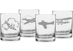 three glasses that have different types of planes on them