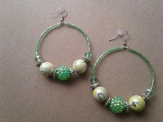 Green and yellow beaded hoop earrings...made using a swirl bead mix, green rondelle beads, green bugle beads, and yellow seed beads.  There's 3 pairs included in this listing...2 green pairs and 1 yellow pair. Please be sure to select which color you would like when you order.  I also want to point out that these pictures barely does these earrings justice...especially the green pairs! They're much more shiny, vibrant, and green in person! Trust me, they are very pretty :-) They're 3 inches in l Green Hoop Beaded Earrings, Green Hoop Earrings With Dangling Beads For Gift, Green Hoop Beaded Earrings With Ear Wire, Green Beaded Hoop Earrings With Ear Wire, Handmade Green Beaded Hoop Earrings, Green Beaded Dangle Hoop Earrings, Green Hoop Beaded Earrings With Dangling Beads, Green Hoop Earrings With Dangling Beads, Bohemian Green Wire Wrapped Hoop Earrings