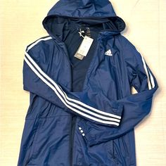 Adidas Wind Jacket, Size M Nwt. Blue Adidas Sporty Windbreaker, Adidas Blue Sporty Windbreaker, Sporty Blue Adidas Windbreaker, Blue Adidas Windbreaker For Sports, Blue Adidas Sports Windbreaker, Blue Adidas Outerwear For Outdoor, Adidas Blue Outdoor Outerwear, Blue Adidas Windbreaker For Spring, Adidas Blue Windbreaker For Spring