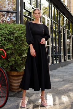 Fabric: Crepe Cotton 75%, Polyester 20%, Elastane 5% Round neckline Puff sleeves Long sleeves Bow tie back detail Button lock at the back Backless dress Midi length Classy Black Dress, Black Dresses Classy, Puff Sleeve Midi Dress, Evening Gowns Elegant, Grad Dresses, Puff Sleeve Dresses, Crop Top Shirts, Sleeve Midi Dress, Dress Midi