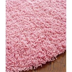 a pink rug is shown on the floor