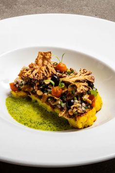 a white plate topped with food on top of a table