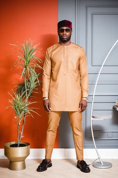 Traditional Trims - Premium Tan Long Sleeve Set Size: Please order the Kaftan according to our Traditional Trims sizing guide or bespoke measurements. Material: Kaftans are crafted from high-quality premium wool. Color Selection: Explore our range of available colors, providing you with a diverse color selection to choose from to suit your preferences and style. Functionality: This Kaftan set is versatile, making it ideal for various events or celebrations such as weddings, business meetings, da Beige Long Sleeve Semi-formal Set, Fitted Elegant Orange Traditional Wear, Classic Fitted Long Sleeve Kurta, Fitted Brown Long Sleeve Sets, Classic Fitted Traditional Wear For Ceremonies, Beige Fitted Traditional Wear With Long Sleeves, Elegant Fitted Orange Kurta, Brown Fitted Long Sleeve Kurta, Classic Gold Long Sleeve Sets