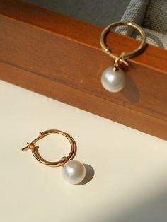 Experience elegant simplicity with our Baroque Pearl Drop Hoop Earrings. The near-round pearls add sophistication and versatility to any look. Celebrate the allure of natural beauty with their unique and exquisite form. Make a statement with these timeless, modern earrings. Metal: 18K Recycled Gold Plated On Brass Gemstone: Freshwater Pearl Pearl Dimensions: 11-11.5mm Dimensions: 3.5cm Weight: Single 3.5g Minimalist Formal Hoop Earrings With Pearl Drop, Formal Minimalist Hoop Earrings With Pearl Drop, Minimalist Hoop Pearl Earrings For Formal Occasions, Formal Minimalist Hoop Pearl Earrings, Hoop Pearl Earrings With Pearl Pendant, Minimalist Yellow Gold Pearl Hoop Earrings, Round Pearl Hoop Earrings With Pendant, Classic Gold Hoop Pearl Earrings, Pearl Pendant Hoop Earrings