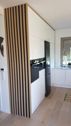 a kitchen with black and white striped wall covering the entire room, including an oven