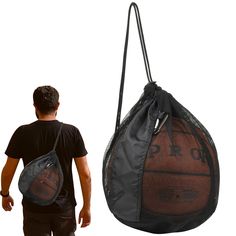 a man carrying a basketball in a gym bag