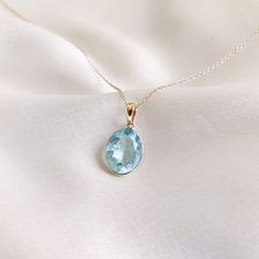 This stunning pendant is set in 14k Solid Yellow Gold with Natural Aquamarine with utmost precision. It is an unique gemstone pendant for nearly every occasion and is completely hassle-free jewelry. 🔷ABOUT GEMSTONE: Aquamarine is often considered a calming and soothing stone. It may help reduce stress, anxiety, and feelings of overwhelm, promoting a sense of tranquility and peace. Aquamarine is thought to enhance courage and inner strength. It may help individuals overcome fears and phobias and Ethereal Jewelry, Aquamarine Gem, Handmade Jewelry Box, Aquamarine Pendant, Aquamarine Jewelry, March Birthstone, Bezel Pendant, Jewelry Birthday, Birthstone Pendant