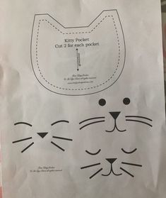 a paper bag with an image of a cat's face and the words kitty pocket cut 2 for each pocket