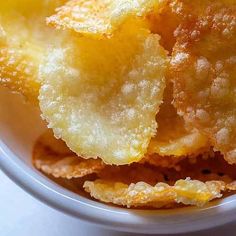 some fried food in a white bowl on a table