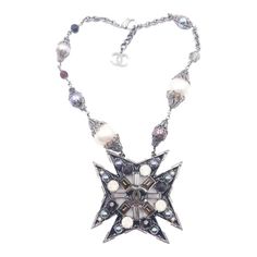 Chanel Rare Gunmetal Star Multi Color Stone Faux Pearl Necklace  *Marked 05 *Made in France *Comes with original box  -The pendant is approximately 3″ x 3″ -The necklace is approximately 16.5″ to 17.5″ total, adjustable length. -This necklace is very rare and stunning. All the crystals and faux pearls are very shinny. -This is one of a kind, and a great gift for Chanel collectors. -There are some pin-sized scratches on the pearl.  3015-46229  Please see the measurements section for best approxim Chanel Pearls, Color Stone, Faux Pearl Necklace, Wedding Accessories, Made In France, Faux Pearl, Stone Color, Original Box, Pearl Necklace