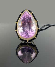 An art-deco necklace, with a 272.02 carat pear shaped Kunzite surrounded by 1.48 carat diamonds. The stones are set in solid 18K gold of 26.38 grams. The silk thread necklace is currently around 32 inches long, but the length can be customized. Please feel free to message for any information or any question you may have.  Details: 18K White Gold: 26.38 Gms  Kunzite: 272.02 Ctw Diamond round: 1.48 Ctw Luxury Drop Jewelry, Luxury Drop Necklace For Evening, Luxury Evening Necklaces, Luxury Pear-shaped Gemstone Necklace, Pear-shaped Gemstone Jewelry For Evening, Luxury Rose Cut Pear Shaped Jewelry, Luxury Teardrop Pendant Jewelry For Formal Occasions, Luxury Drop Jewelry For Party, Luxury Teardrop Necklace For Formal Occasions