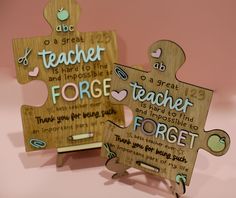 two wooden puzzle pieces with words on them, one for teacher and the other for forgeter