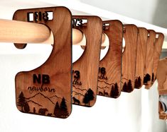 wooden cutting boards are hanging on the wall