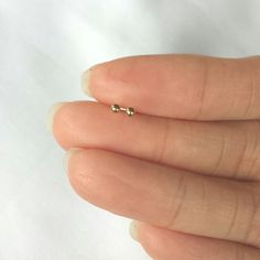 These cute studs are very tiny . They are made of 925 sterling silver ( not silver plated) then dipped in 18k gold . so they are safe for you if you have an allergy, have butterfly earnuts. The picture shows 2mm earrings. I have them available in many size 2mm, 3mm, to 6mm. Please select an size at the drop out menu The item wil be sent in a gift box. ------------------------------------------------------------------- Please read my shop policy before placing your order. Gold Ball Earrings, Earrings Cartilage, Baby Earrings, Simple Stud Earrings, Ball Earrings, Kids Earrings, Earrings Simple, Earrings Dainty, Earrings Minimalist